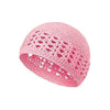 A pink handmade crochet beanie hat with an openwork lace pattern.