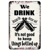 A distressed white sign with black text that reads We DRINK because the doctor said It's not good to keep things bottled up