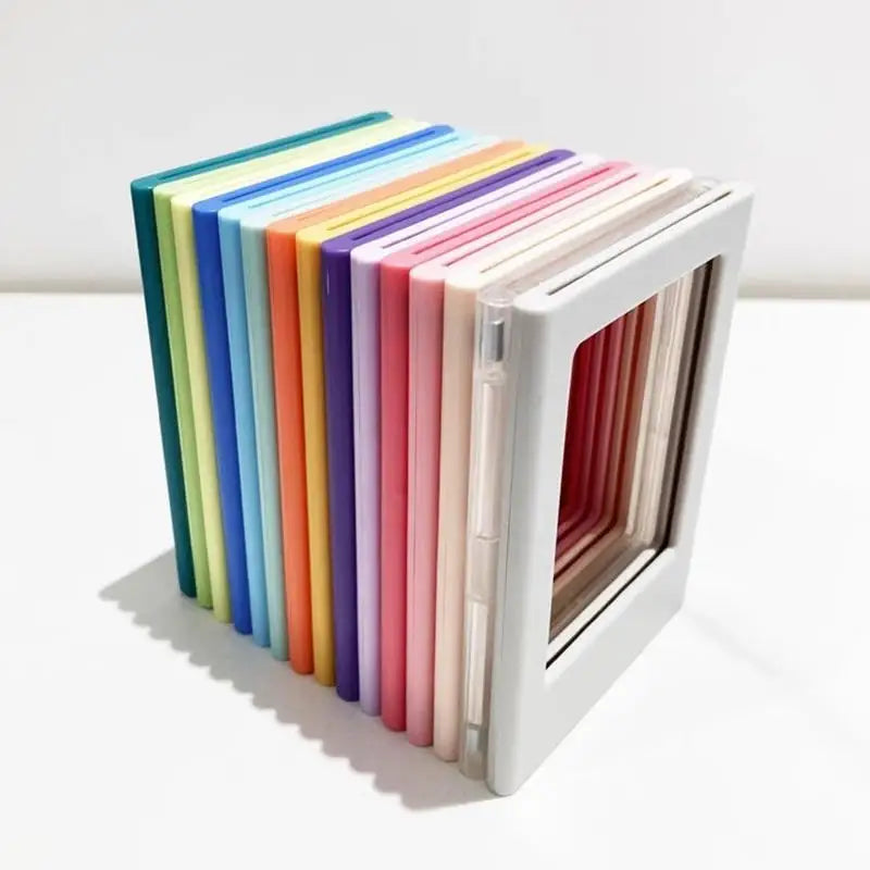 A set of five colorful photo frame magnets arranged in a row inside a white display frame.