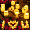 A collection of glowing yellow LED tea light candles set against a dark background with red roses.