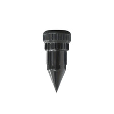 Black realistic watering can key hider designed for outdoor security.