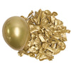 A golden latex balloon next to a pile of crumpled gold foil streamers.