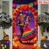 A vibrant decorative banner featuring a couple in Mexican-style attire framed by an orange floral arch and Halloween elements