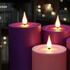 A set of purple and pink flameless LED candles with a remote control device shown in a dimly lit indoor setting.