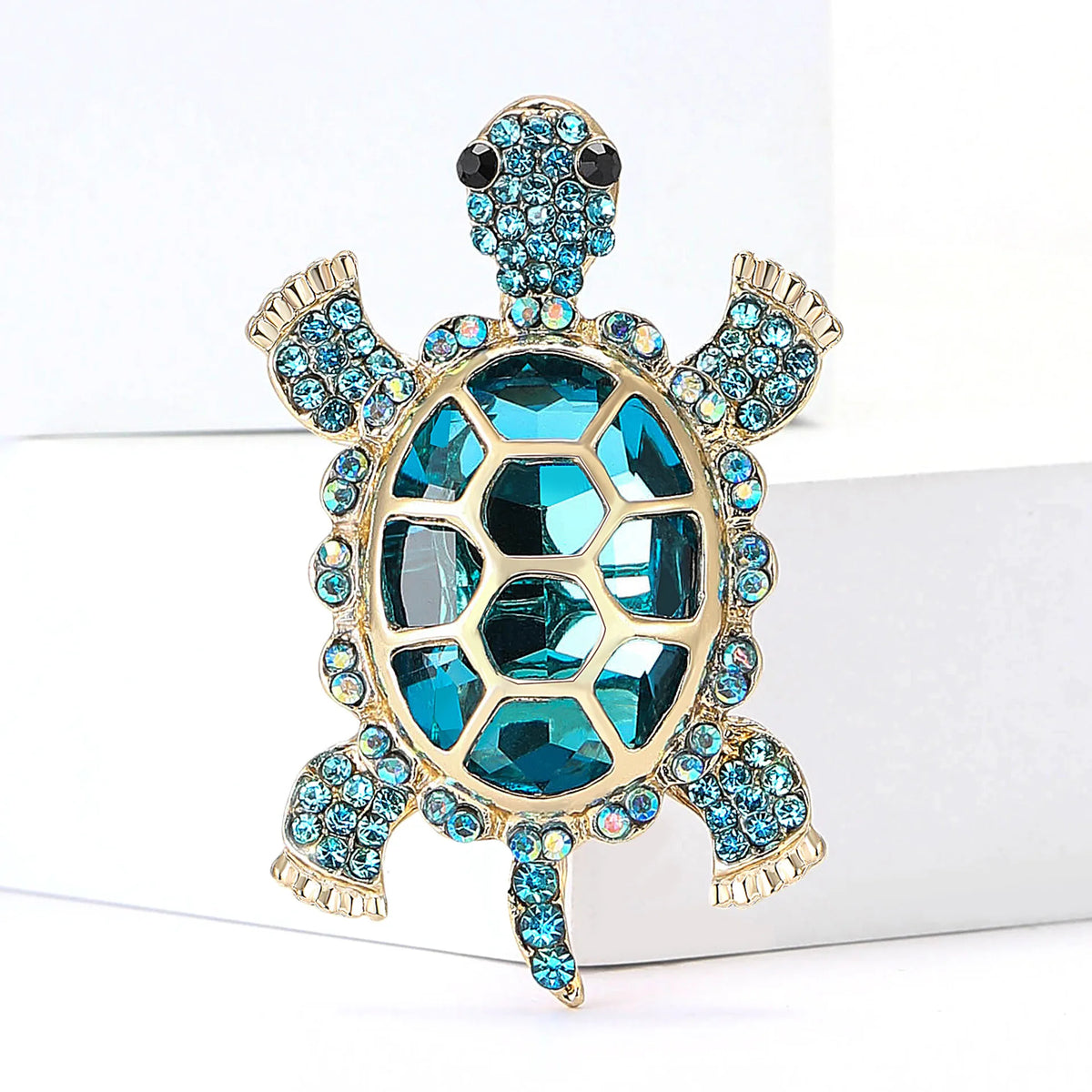 Vintage marine life brooch pin set featuring a gold-toned starfish with blue and teal gemstones