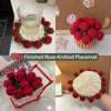 Finished rose knitted placemat featuring deep red roses on a natural woven base.