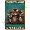 Three adorable brown animal figures holding napkins on a vintage metal sign titled Your Butt Napkins My Lady