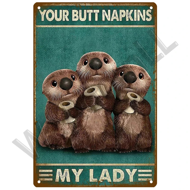 Three adorable brown animal figures holding napkins on a vintage metal sign titled Your Butt Napkins My Lady