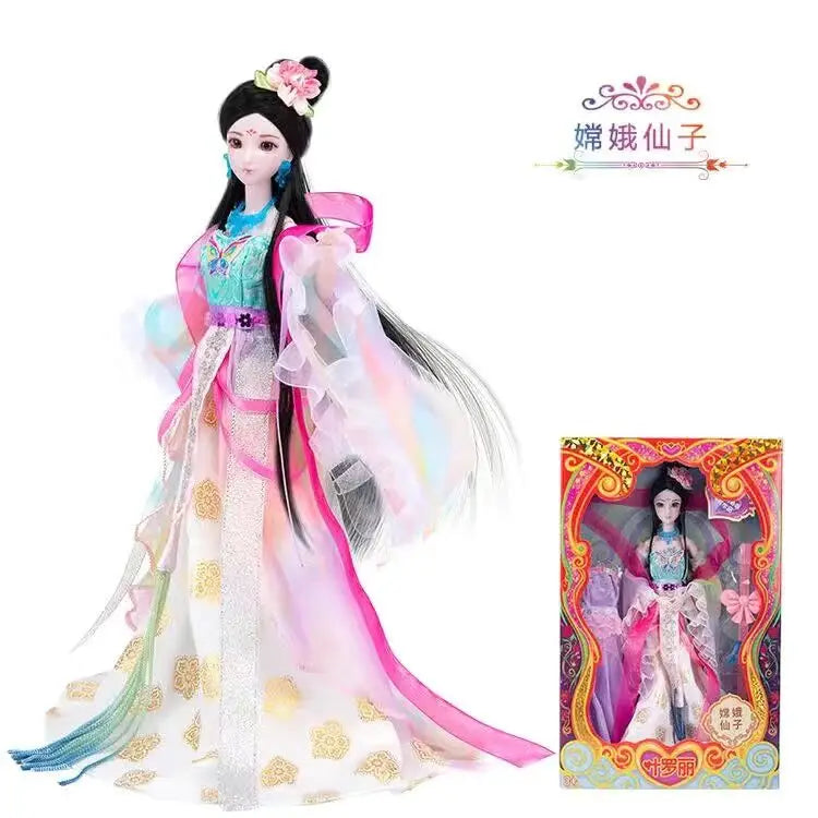A detailed ball-jointed doll dressed in a pink and teal gown with elaborate makeup and long flowing hair.
