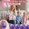 A pink and silver balloon gift box is held by a woman, with children nearby. Purple Halloween themed sticky fidget dumplings 