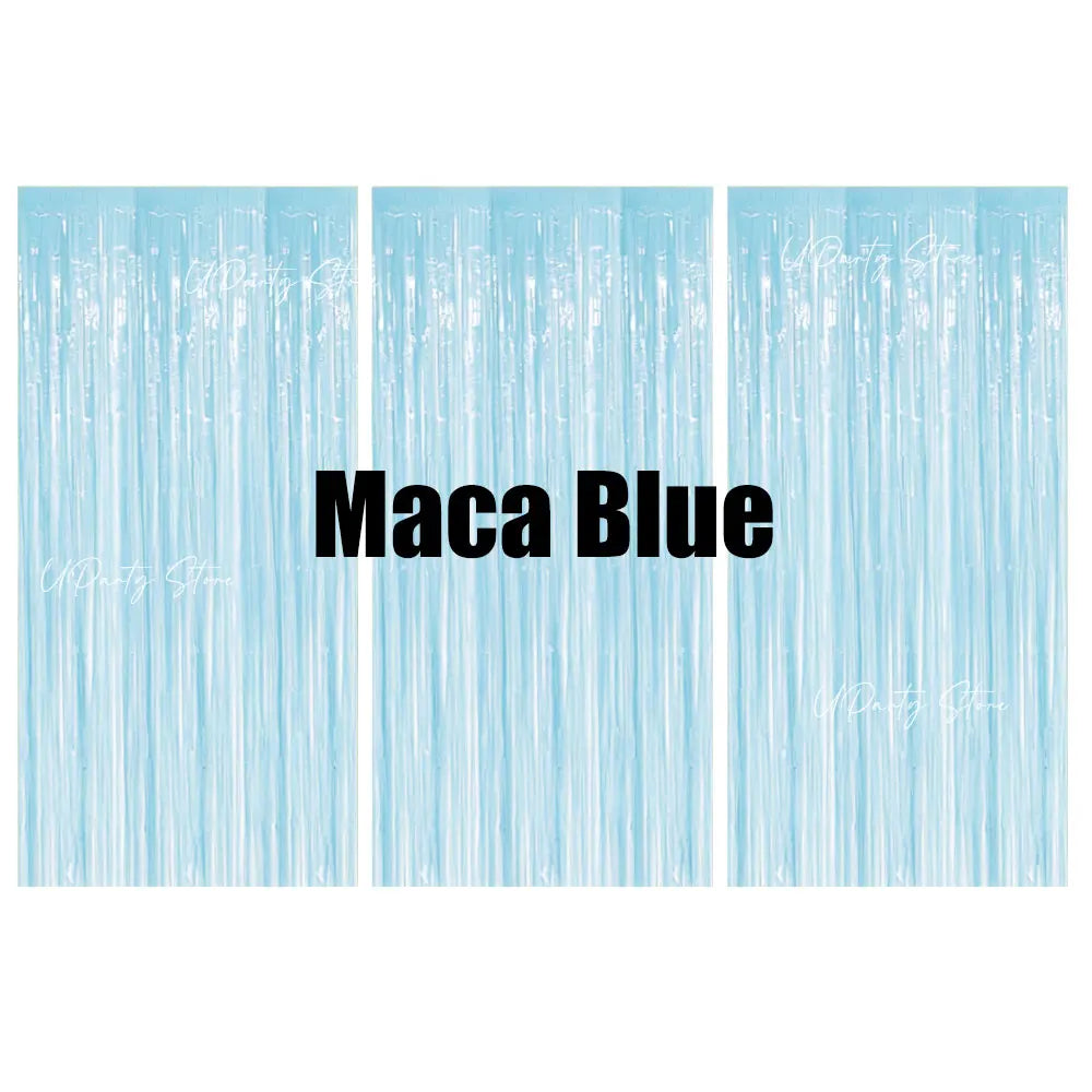 Vertical panels of light blue metallic foil fringe curtains used as a party backdrop decor.