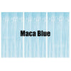 Three vertical panels of light blue metallic fringe curtains used as a party backdrop decor.