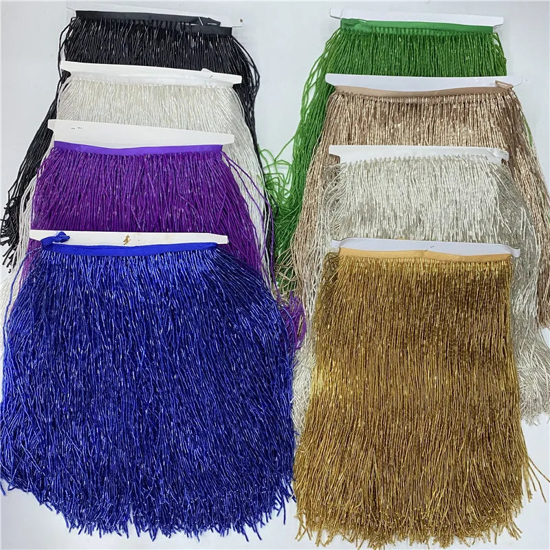 A collection of colorful beaded tassel fringe trims in various shades including black, white, purple, blue, and gold.
