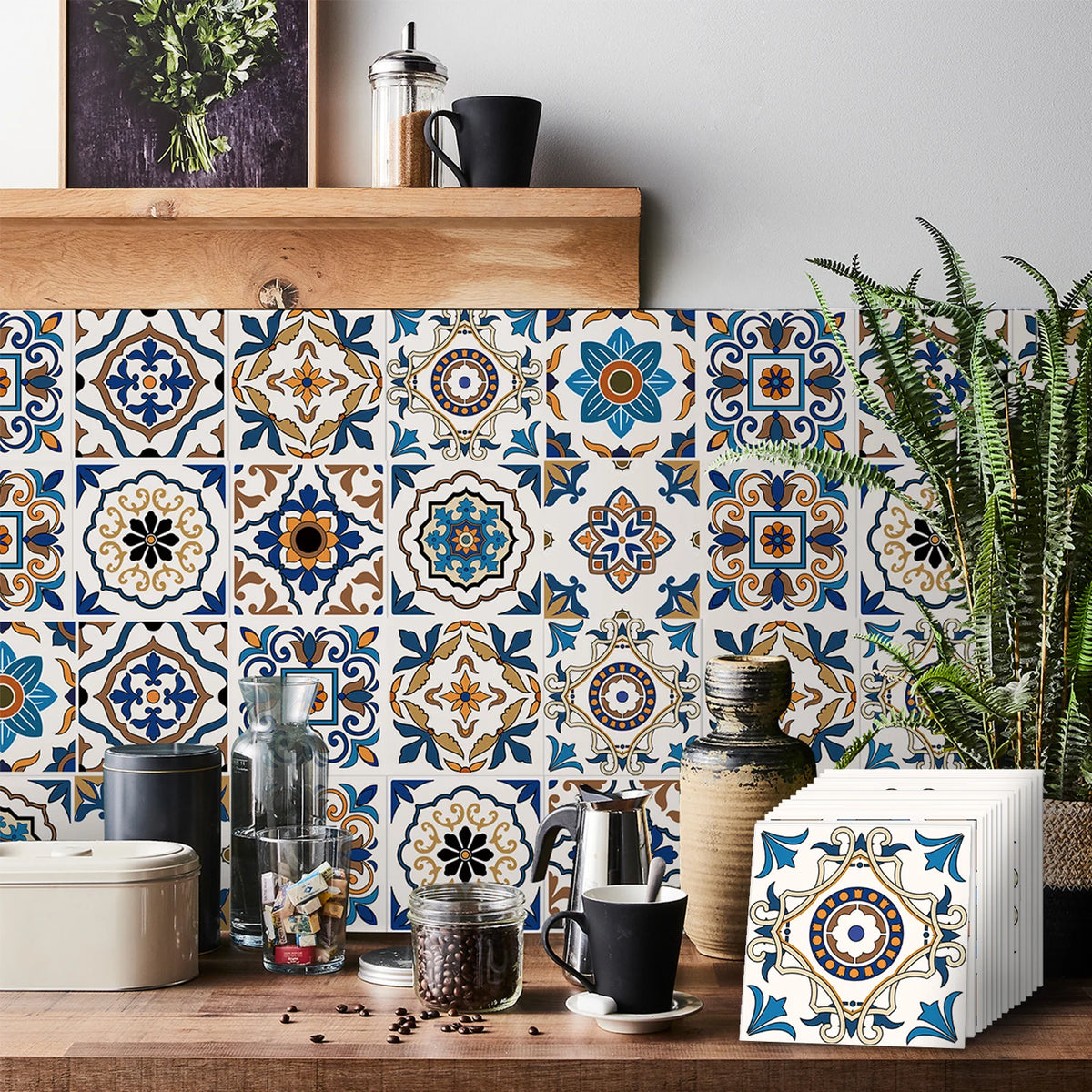 A close-up of self-adhesive tile wall stickers featuring blue, orange, and white geometric patterns on a wooden surface.