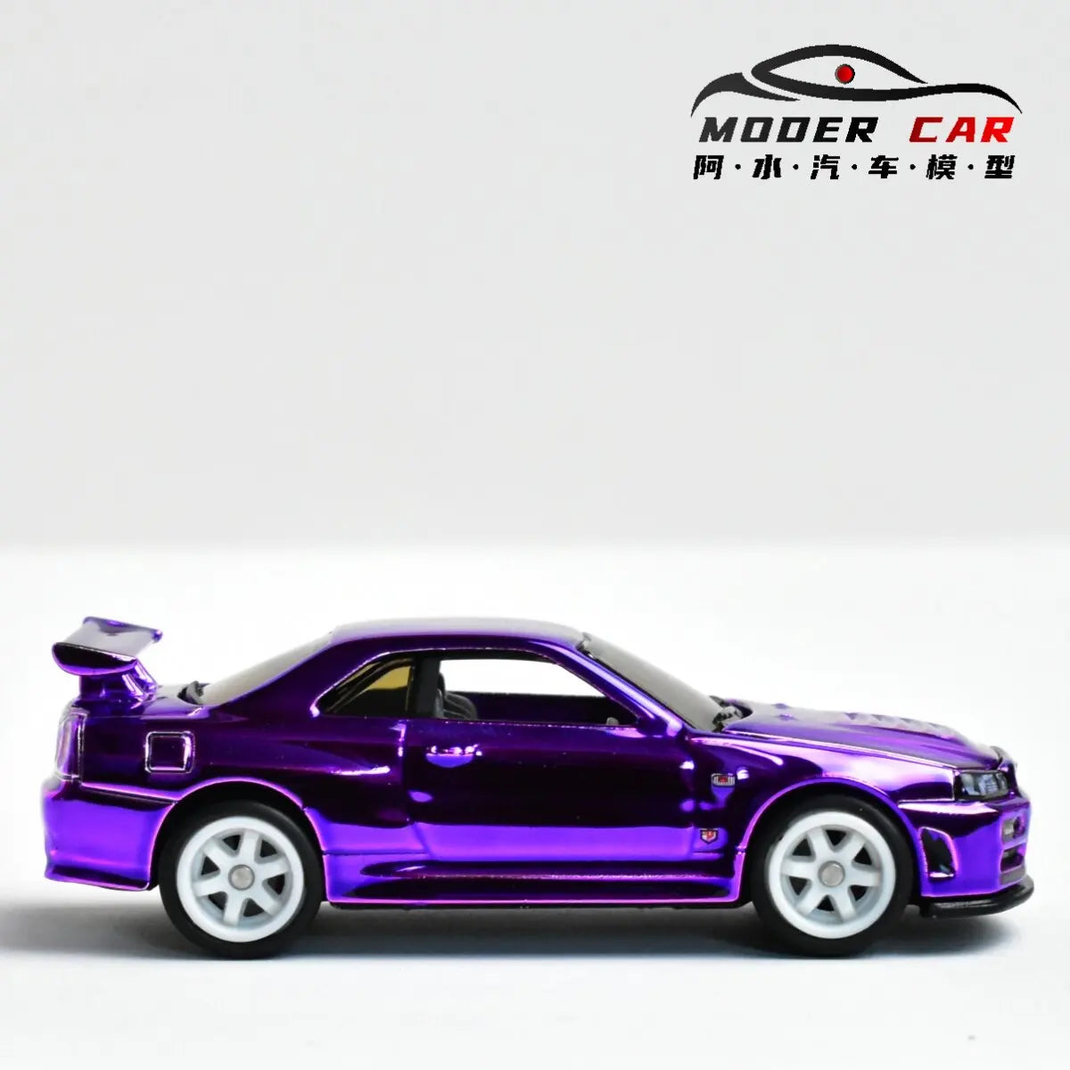 A diecast model of a Nissan GTR R34 in a vibrant purple electroplated finish.
