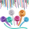 A collection of glossy latex modeling balloons in various colors and shades, including purple, pink, blue, and gold.