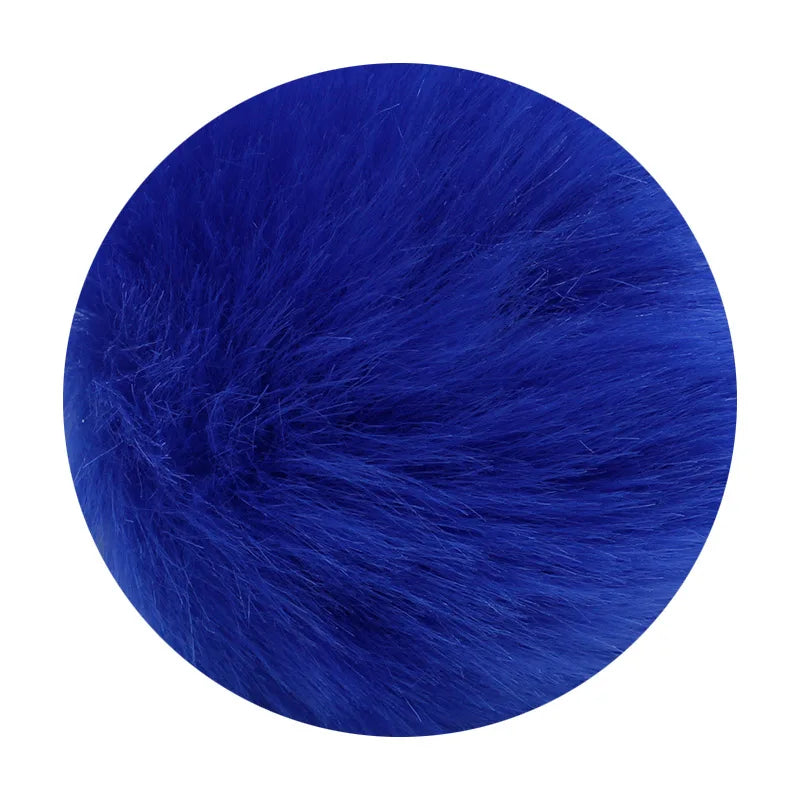 A deep royal blue faux fur pom pom keychain with a silver chain.