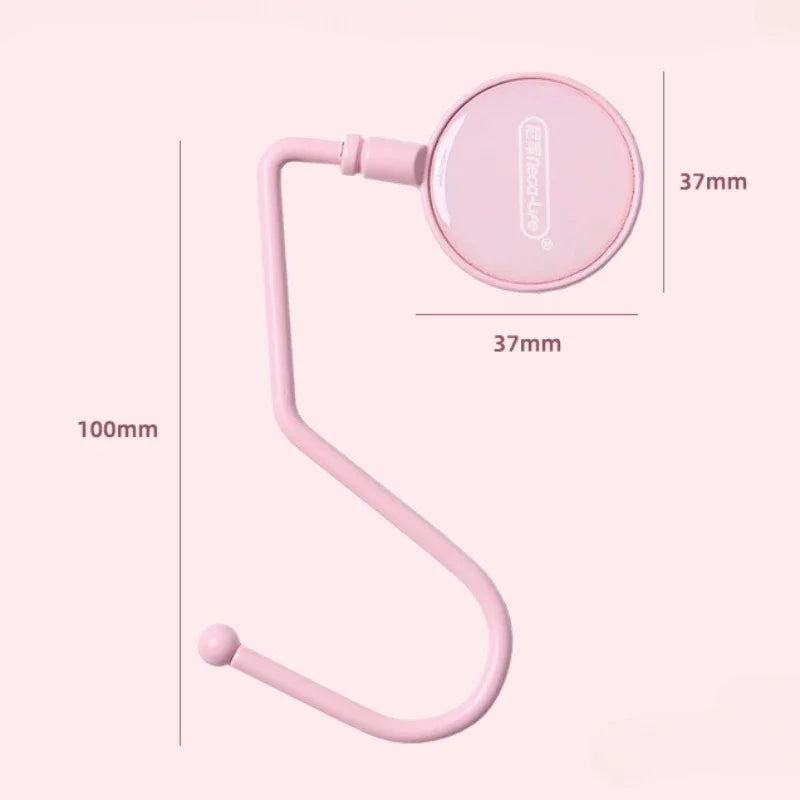 A pink heavy duty purse and bag hook with a curved arm and circular hook for organization.