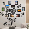 A wall collage featuring a family tree design with framed photos and text on a white wall.