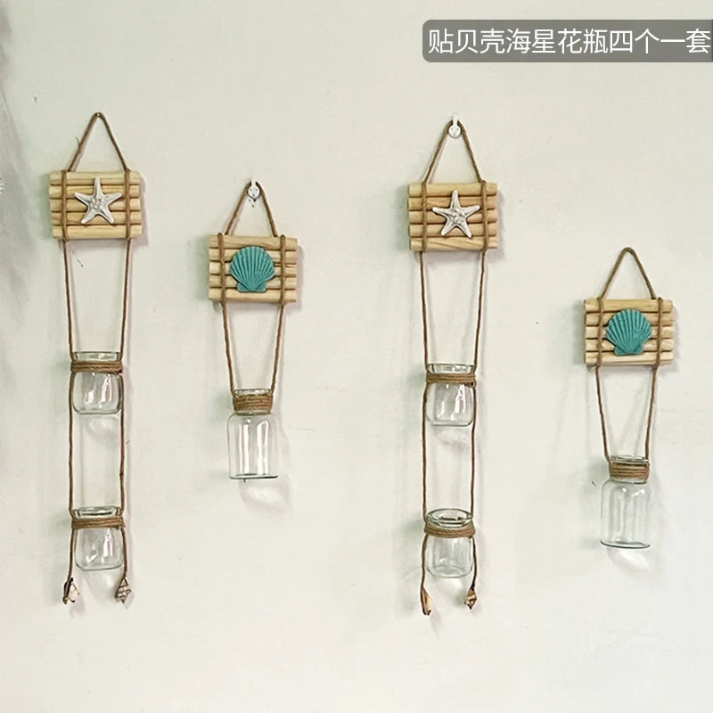 Four sets of decorative glass terrariums featuring starfish and seashell decorations