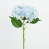 A sprig of artificial light blue hydrangea flowers with green leaves on a stem.