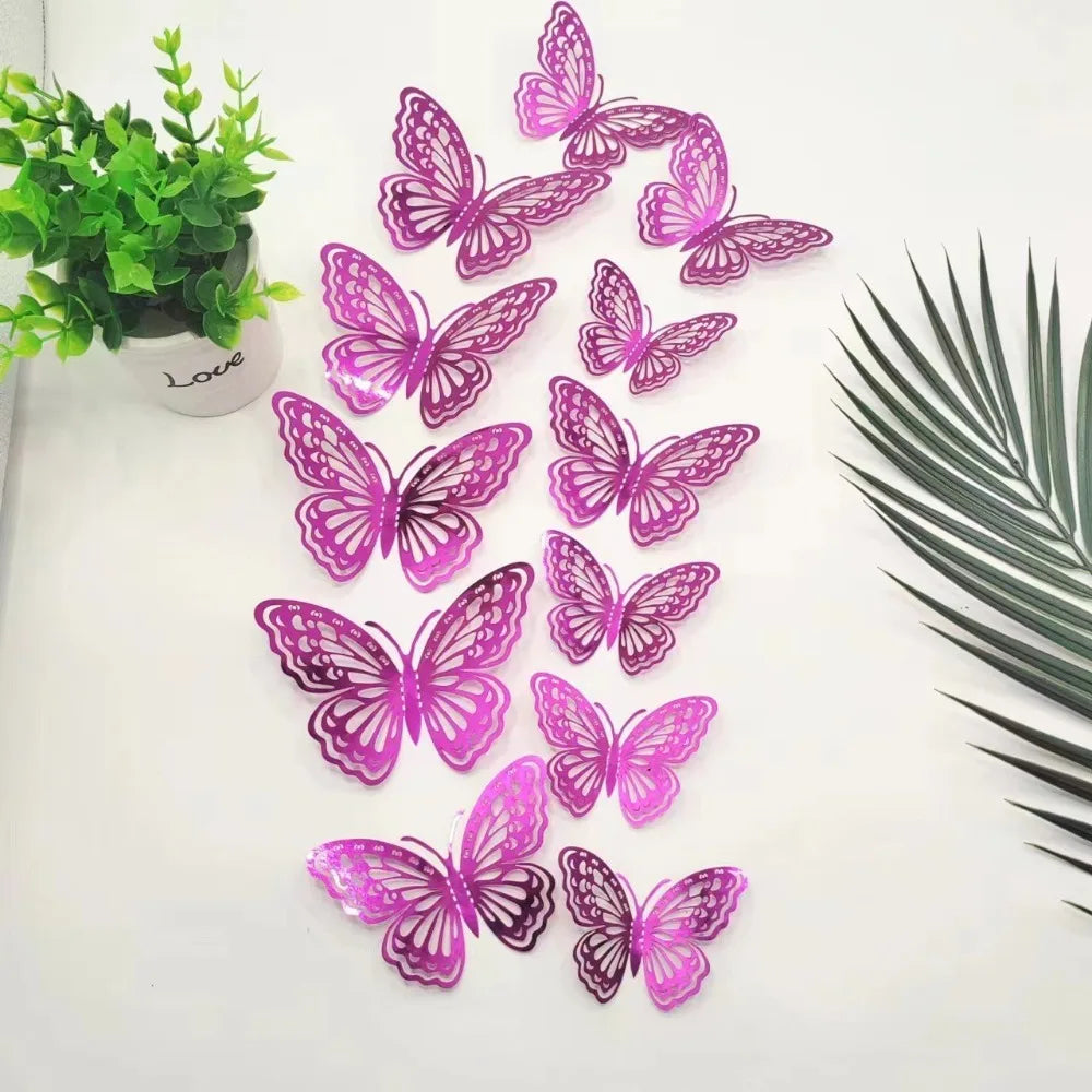 A set of twelve pink and purple 3D butterfly wall stickers displayed on a white surface next to a potted green plant.
