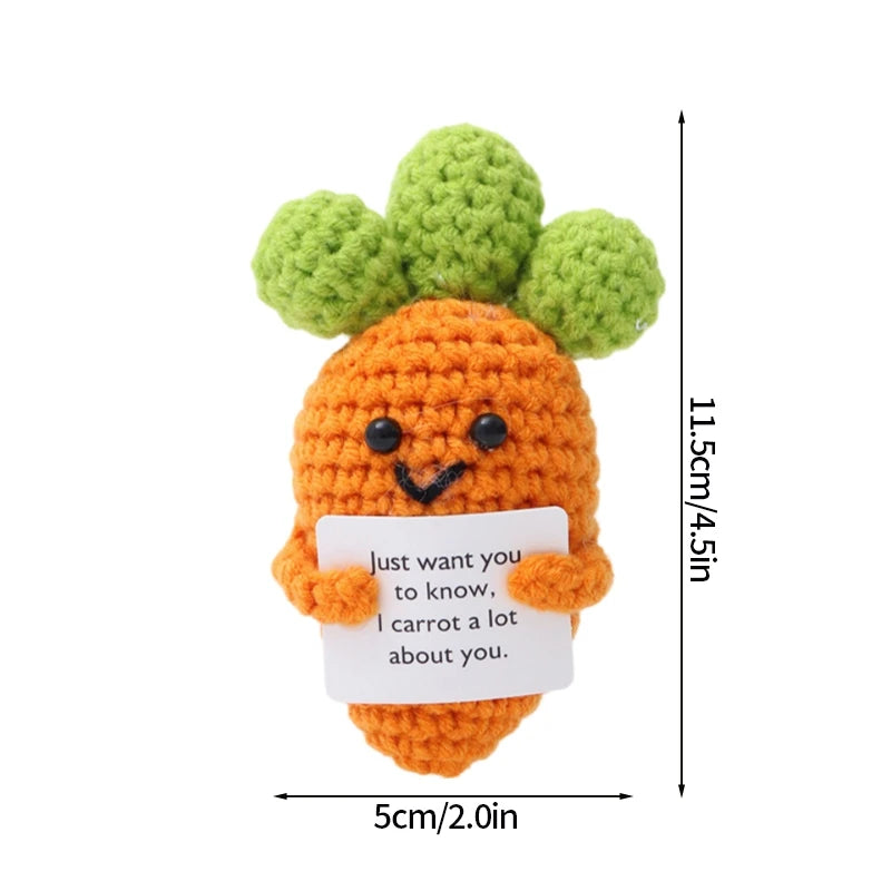 Handmade crochet potato doll with green sprouts and a pocket featuring an inspirational message