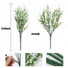 A tall artificial flower bouquet featuring green stems and white blossoms, shown from the side and close-up views.