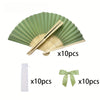 A set of ten light green folding hand fans with accompanying ribbon and white fabric.