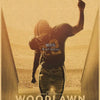 A movie poster for Woodlawn featuring a silhouette of a person raising a finger against a golden background.