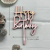 A pink acrylic birthday cake topper set with the words Happy Birthday on a stick.