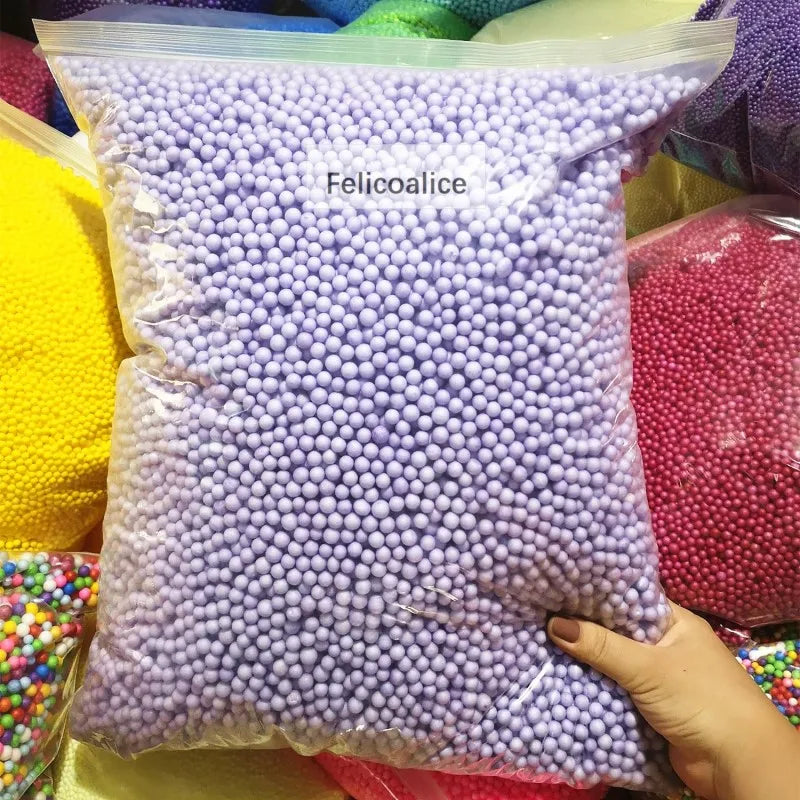 A clear bag filled with purple foam beads labeled Felicoalice for crafting and decoration.