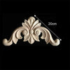 A set of four wooden carved corner appliques used for furniture and frame decoration.