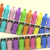 A set of colorful plastic bottles arranged in a row for a matching game.