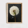 A framed painting featuring a white dandelion seed head against a dark background.