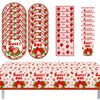 A set of red and green strawberry themed disposable birthday party tableware including plates, napkins, and cups.
