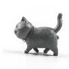 A dark gray 3D cartoon cat figurine used as a refrigerator magnet.