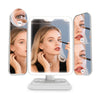 An LED trifold makeup mirror showing a woman's face with adjustable lighting and magnification options.