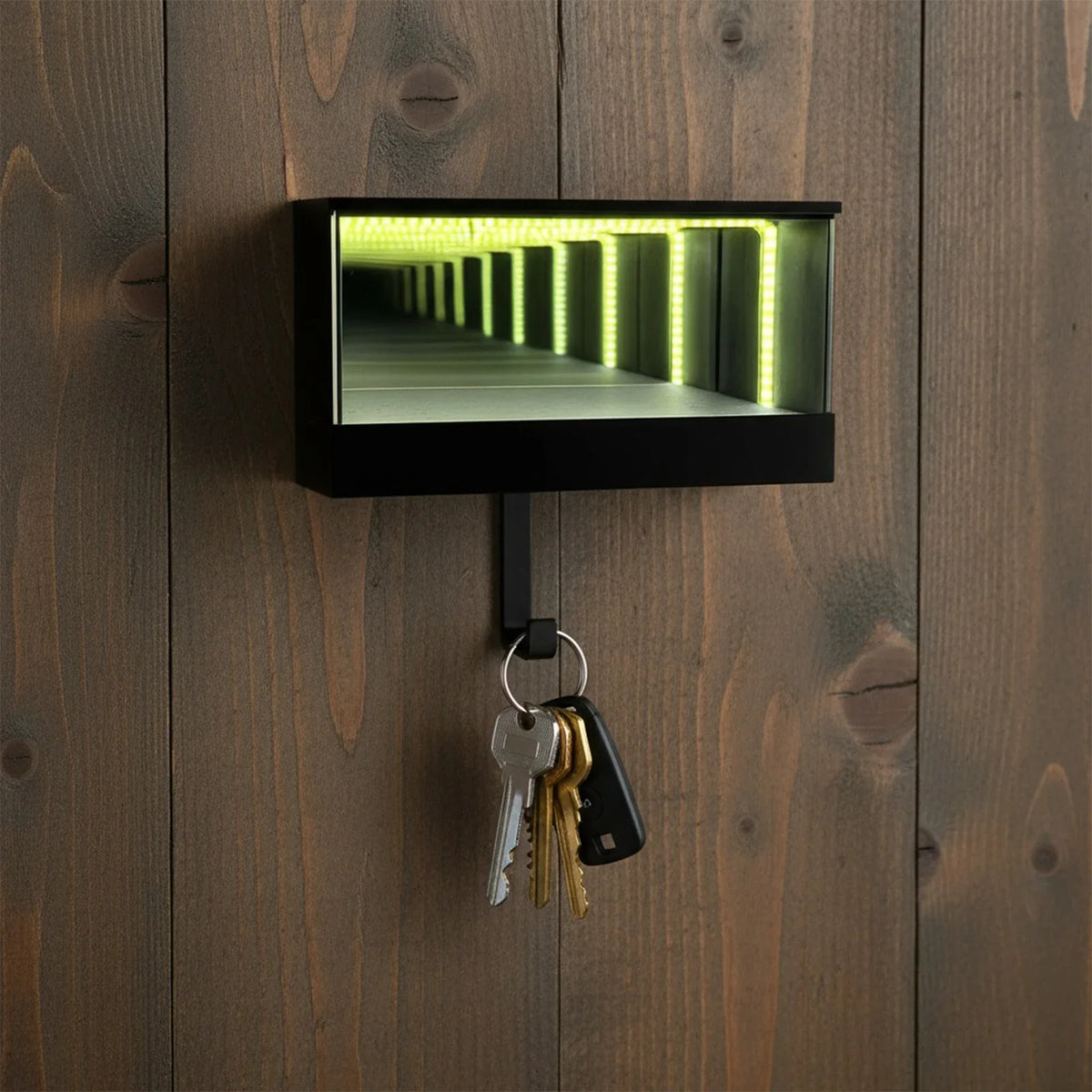 A black rectangular keychain holder with an LED tunnel effect is mounted on dark wood paneling.
