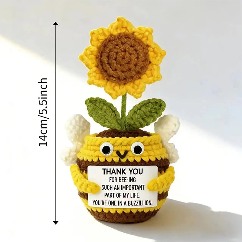 Hand crocheted sunflower bee potted ornament with yellow petals and green leaves