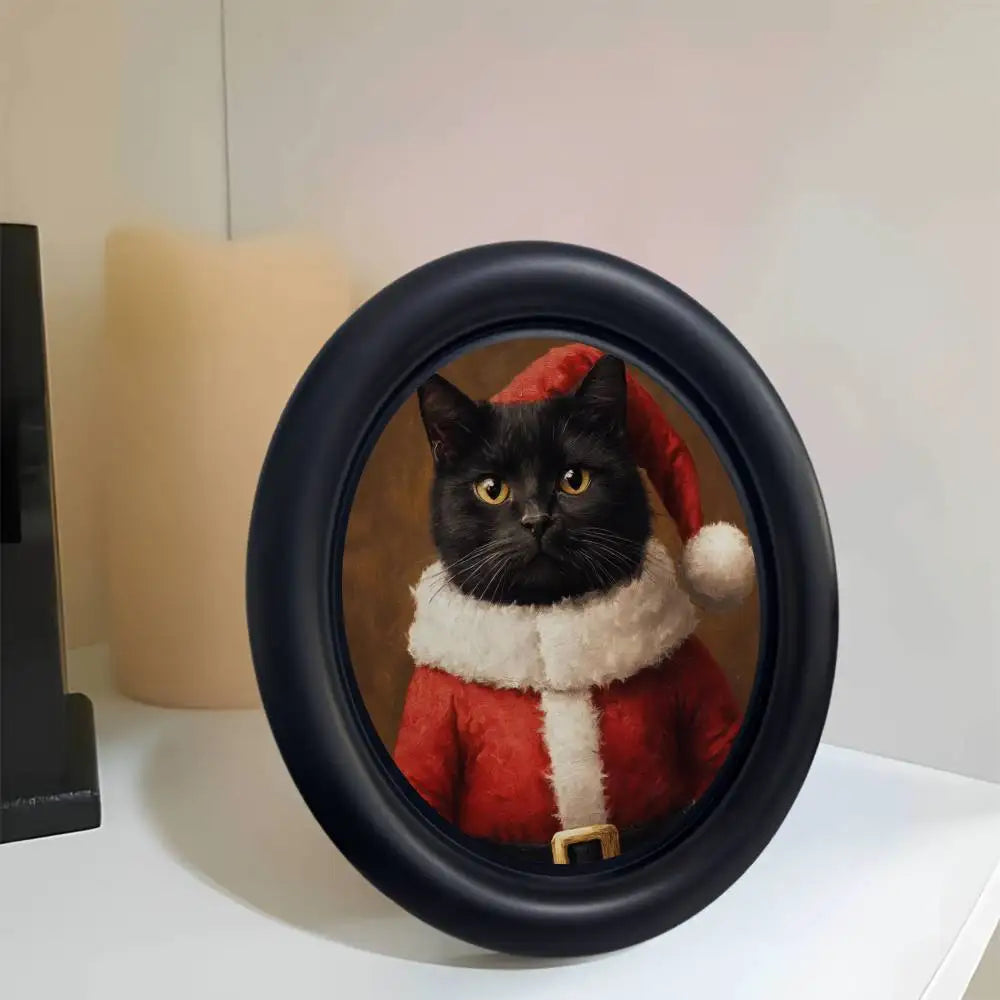 A black wooden photo frame featuring a portrait of a cat wearing a red and white festive collar.