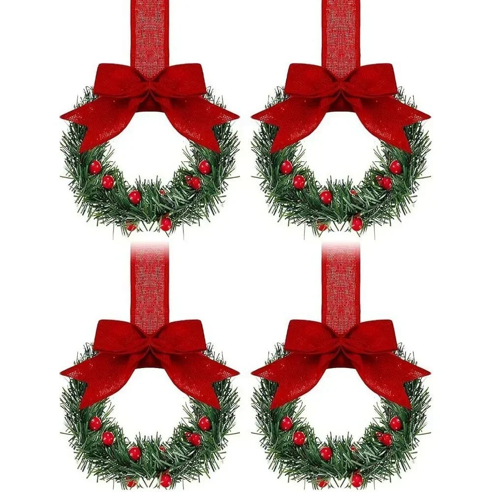 Set of four mini Christmas wreaths with red ribbon bows and red berries
