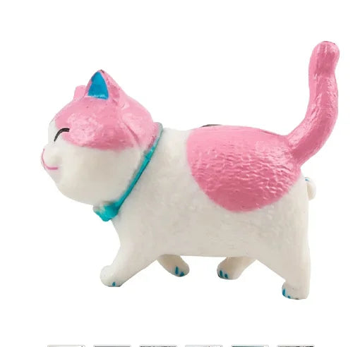 A white and pink 3D cartoon cat figurine with a long tail, used as a refrigerator magnet.