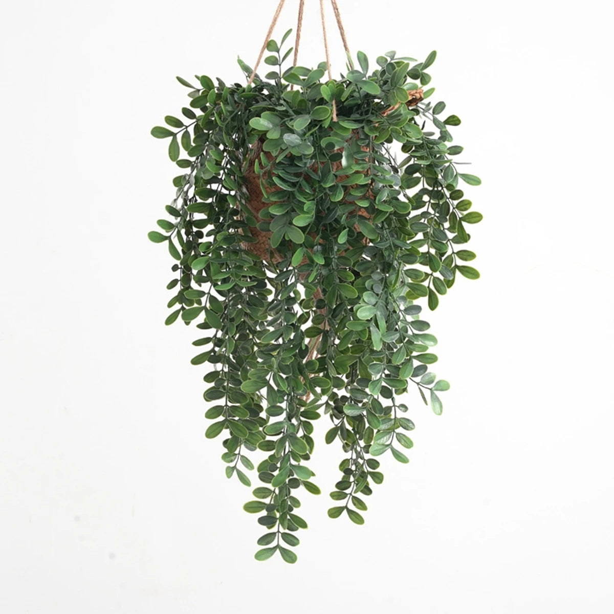 Artificial ivy vine with green leaves hanging from a natural fiber hanger