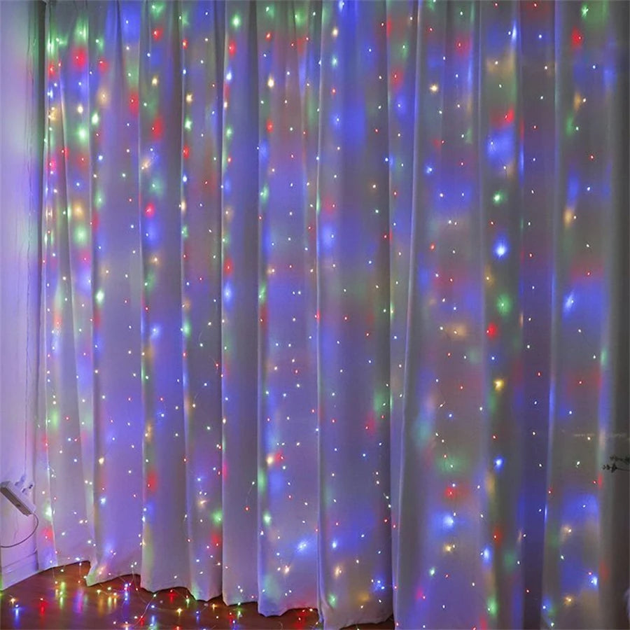 White curtain illuminated by colorful LED string lights creating a starry effect