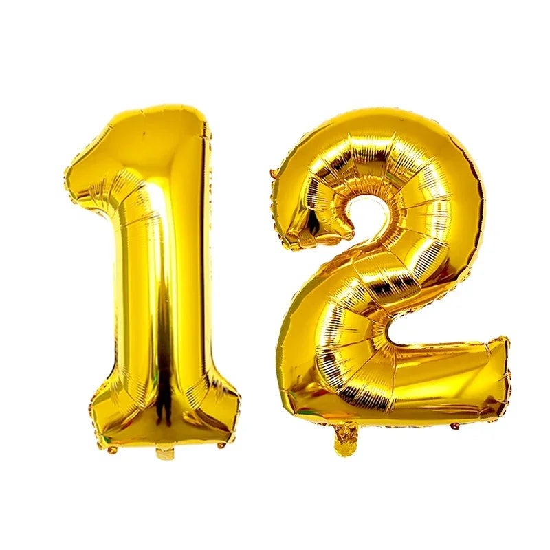 A set of gold foil number balloons shaped like the numbers 1 and 2.