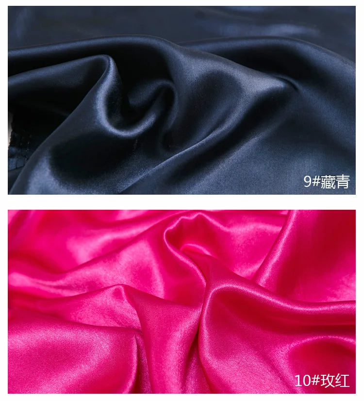 Two swatches of satin fabric, one black and one pink, showing the drape and sheen.