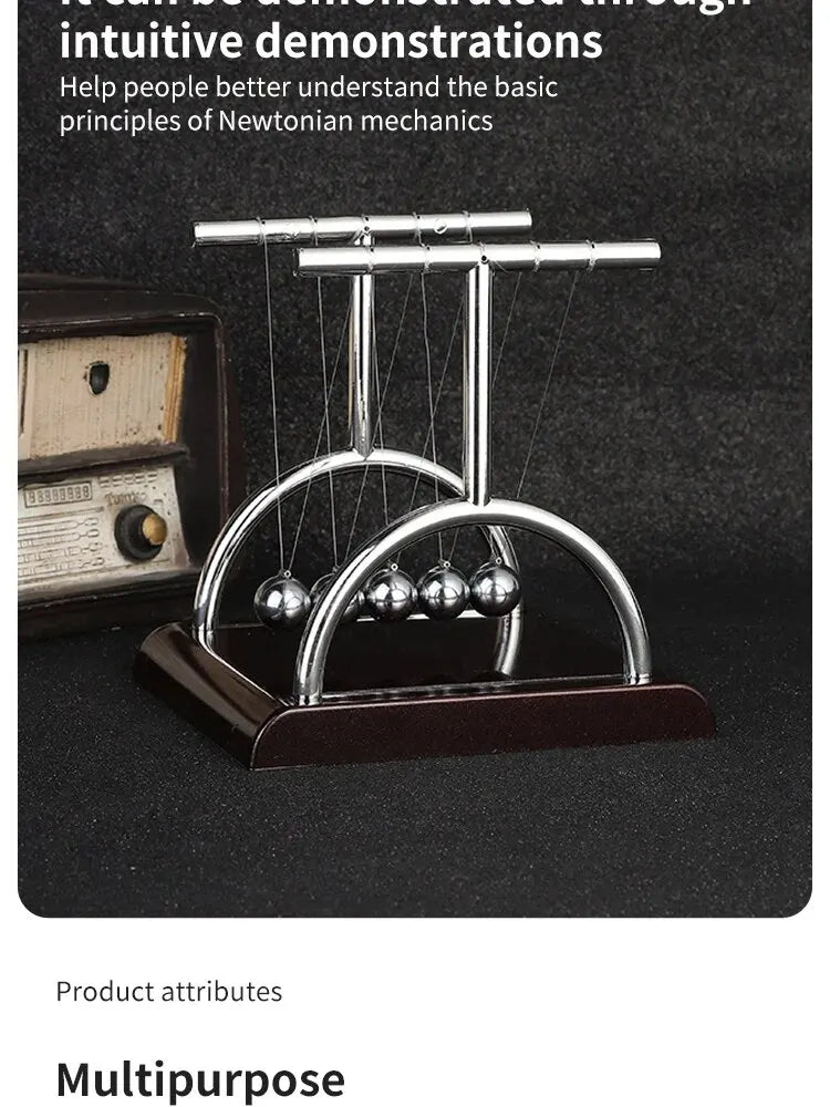A silver Newton's cradle demonstration featuring balance balls on a dark wooden base.