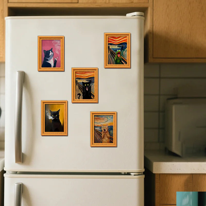 A white refrigerator door decorated with several framed pictures of black cats.