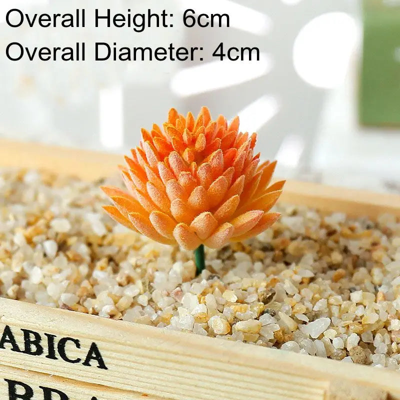 An orange succulent bonsai ball with a green stem rests on a wooden tray filled with small pebbles.